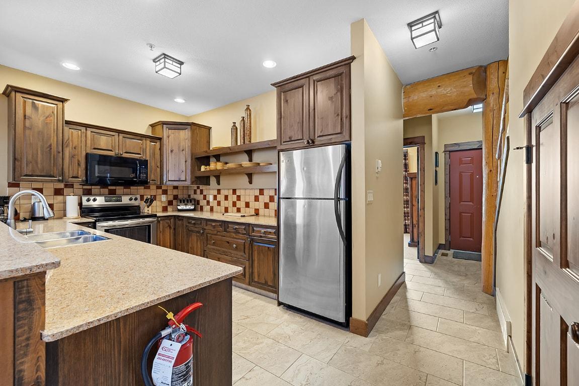M1-A-1351 Gerry Sorensen Way, Kimberley, BC - Indoor Photo Showing Kitchen With Double Sink