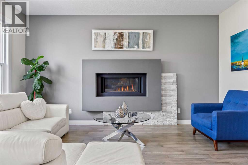144 Legacy Mount Se, Calgary, AB - Indoor Photo Showing Living Room With Fireplace