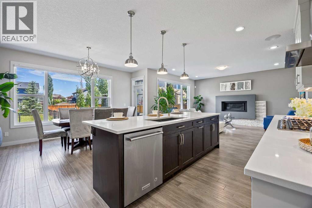 144 Legacy Mount Se, Calgary, AB - Indoor Photo Showing Kitchen With Fireplace With Double Sink With Upgraded Kitchen