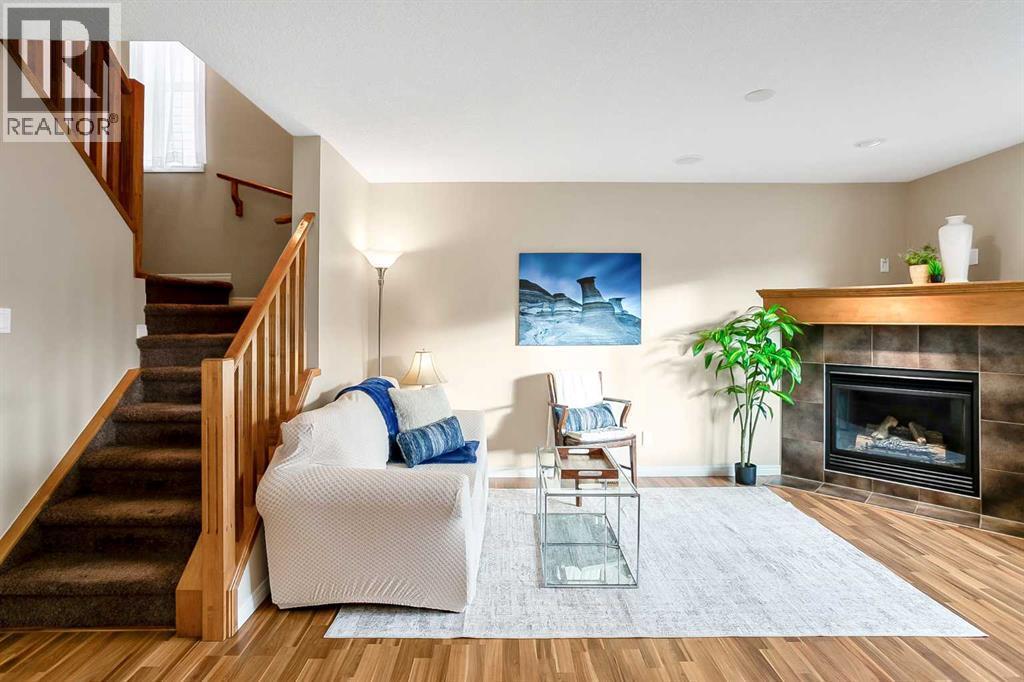 37 Silverado Saddle Avenue Sw, Calgary, AB - Indoor Photo Showing Living Room With Fireplace