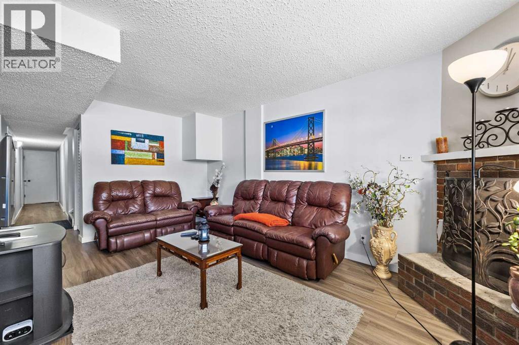 11254 6 Street Sw, Calgary, AB - Indoor Photo Showing Living Room With Fireplace