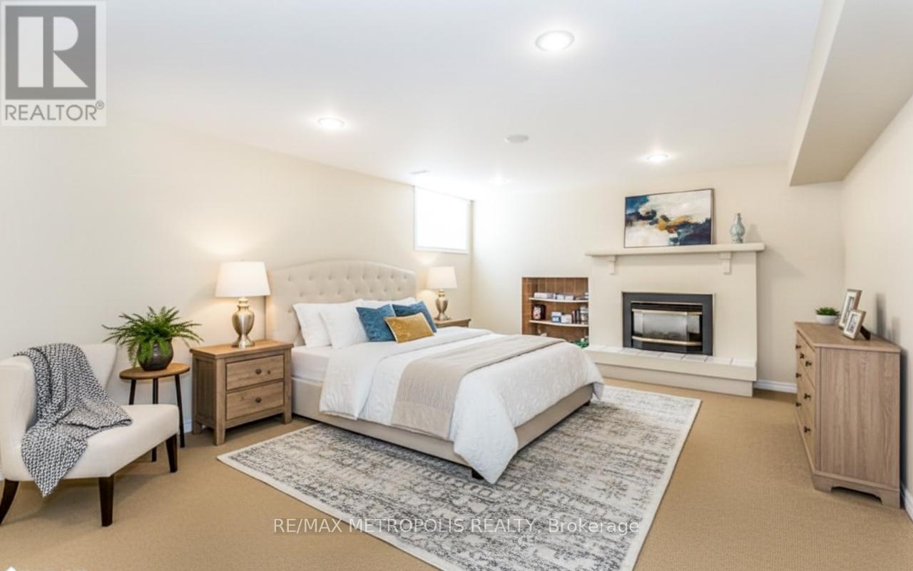 65 Woodcrest Road, Barrie, ON - Indoor Photo Showing Bedroom With Fireplace