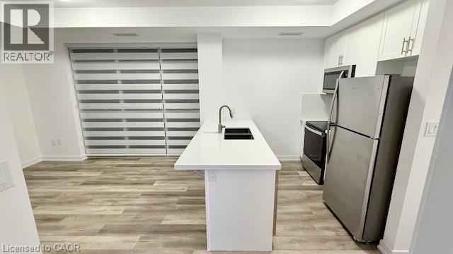 470 Dundas Street E Unit# 1009, Waterdown, ON - Indoor Photo Showing Kitchen With Double Sink