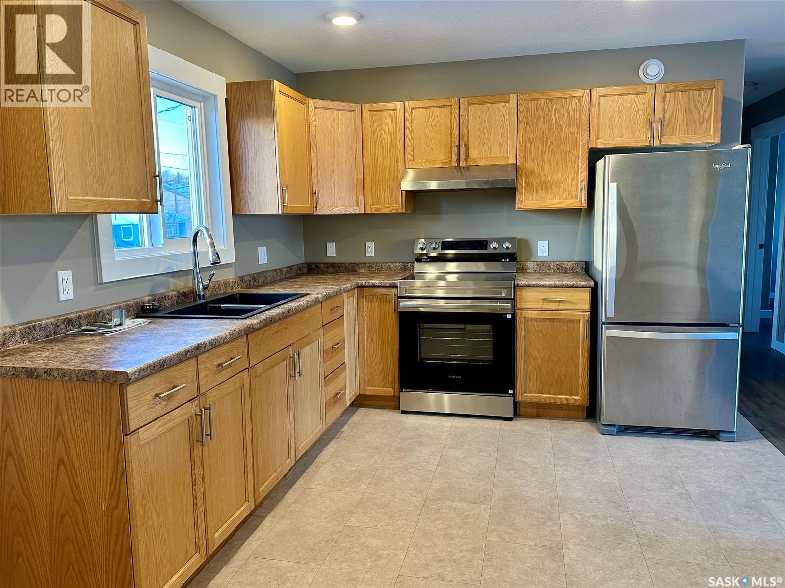 595 Cook Crescent, La Ronge, SK - Indoor Photo Showing Kitchen With Double Sink