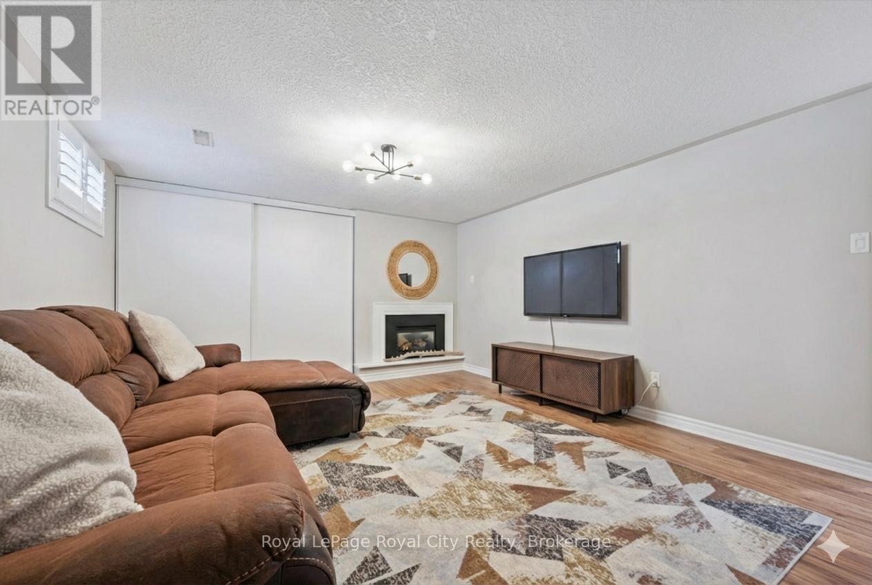 Basement Rec Room - 18 Uplands Place, Guelph (Victoria North), ON - Indoor Photo Showing Living Room With Fireplace