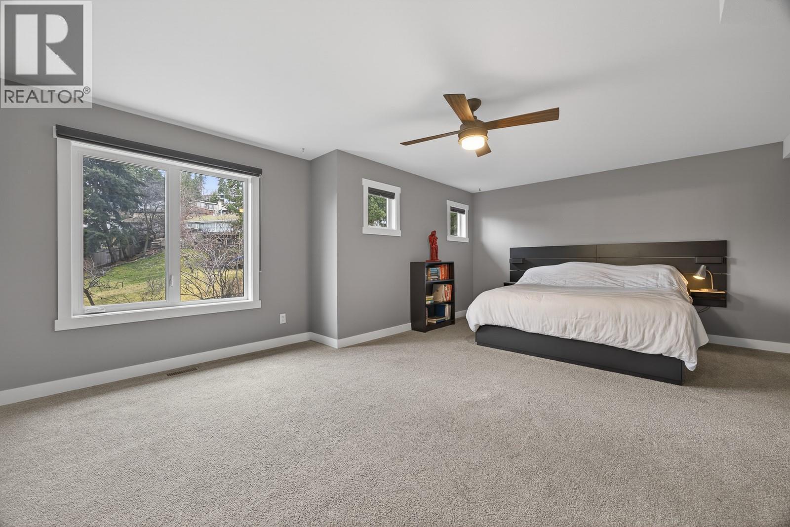Oversized Primary Bedroom Retreat - 2893 Robinson Road Unit# 5, Lake Country, BC - Indoor Photo Showing Bedroom
