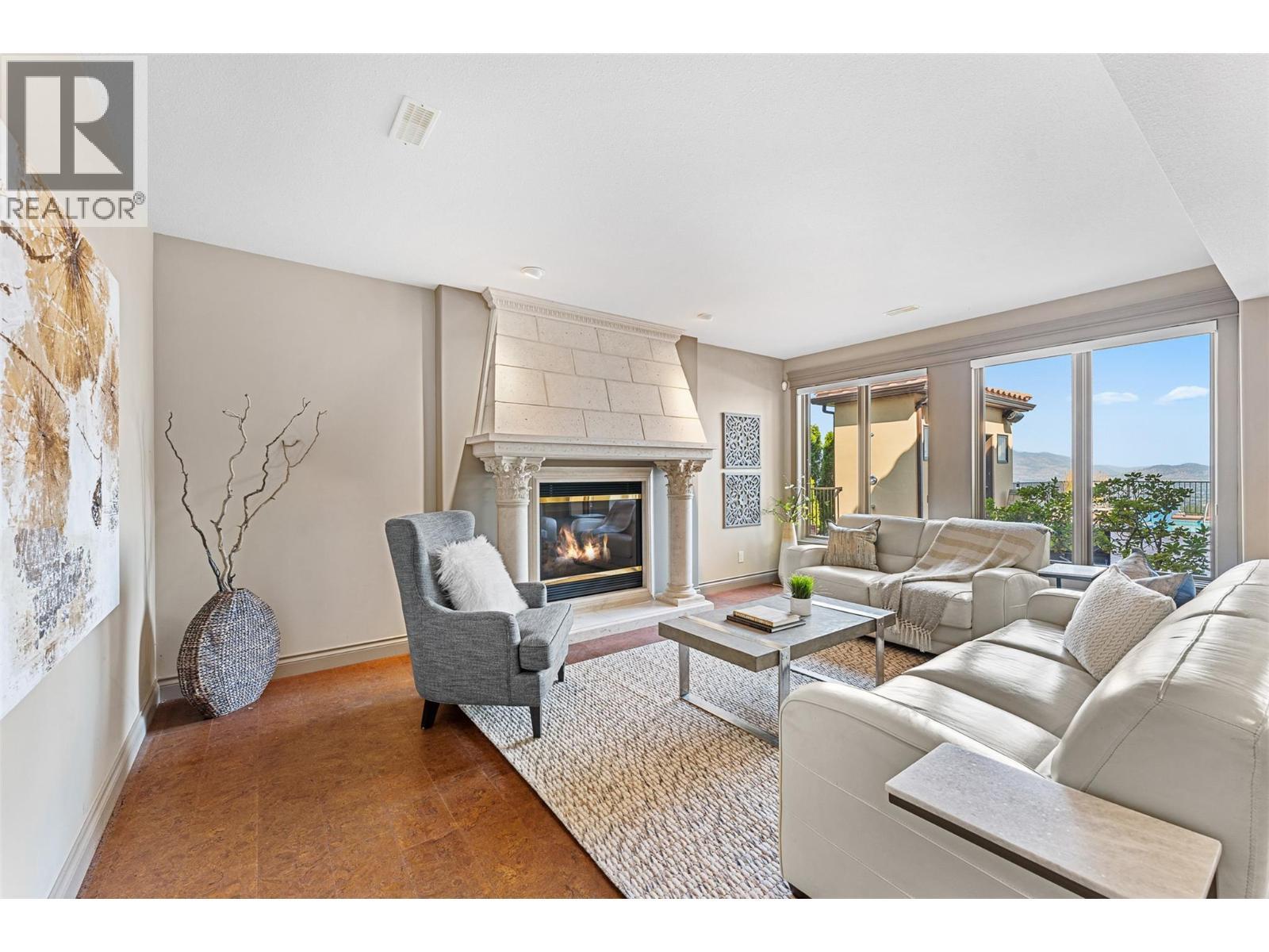 660 Almandine Court, Kelowna, BC - Indoor Photo Showing Living Room With Fireplace