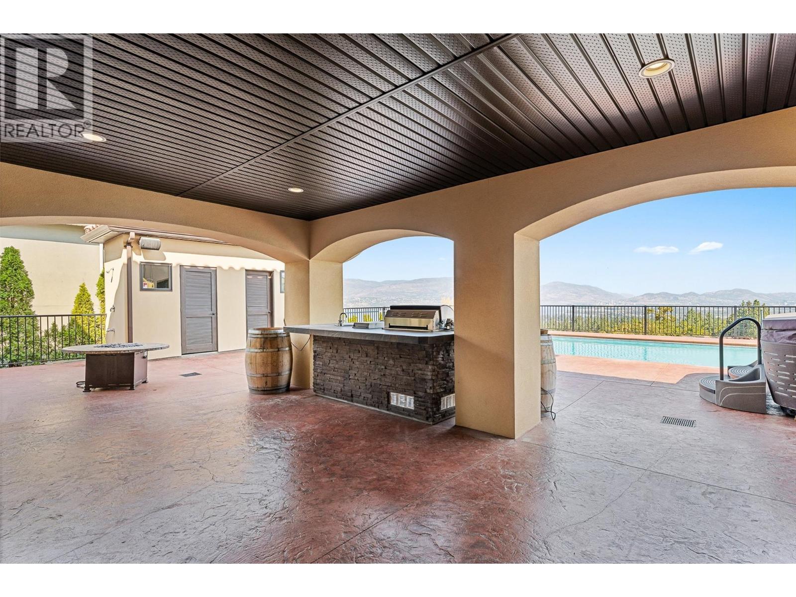 660 Almandine Court, Kelowna, BC - Outdoor With In Ground Pool With Deck Patio Veranda With Exterior