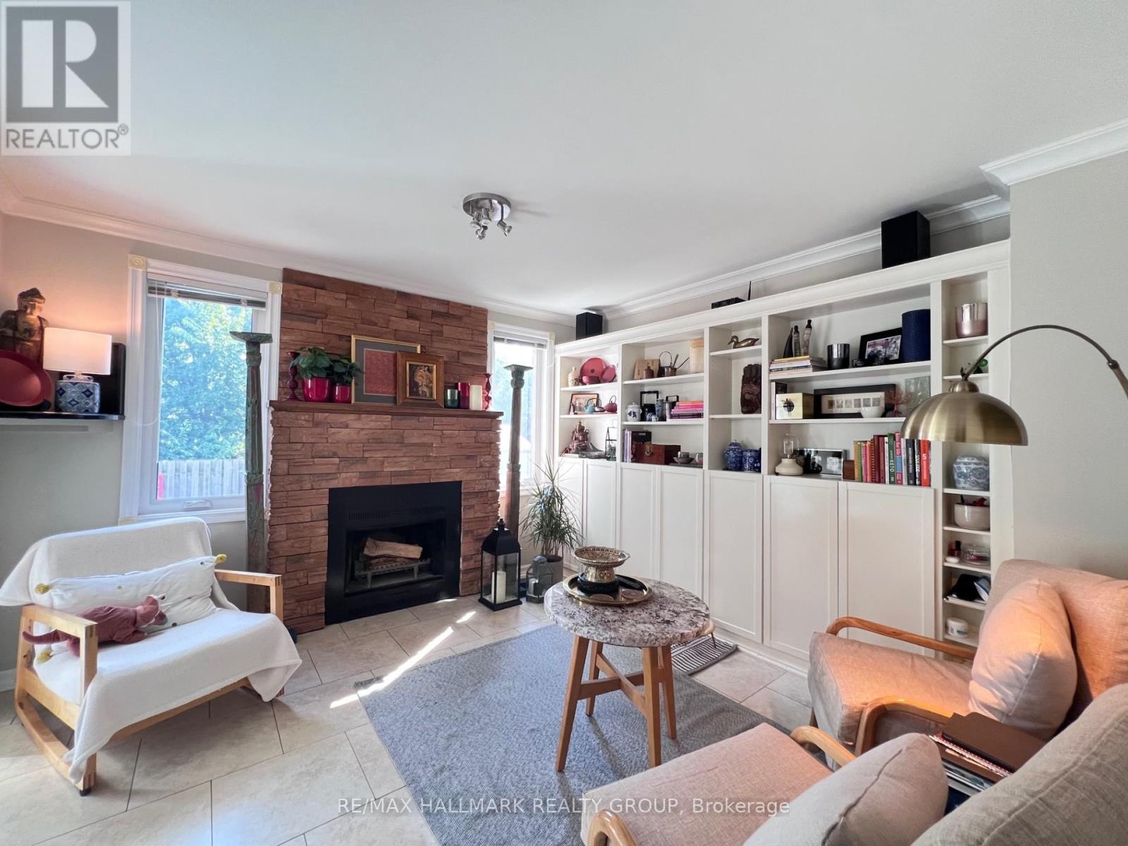 4 Cadence Gate, Ottawa, ON - Indoor Photo Showing Living Room With Fireplace