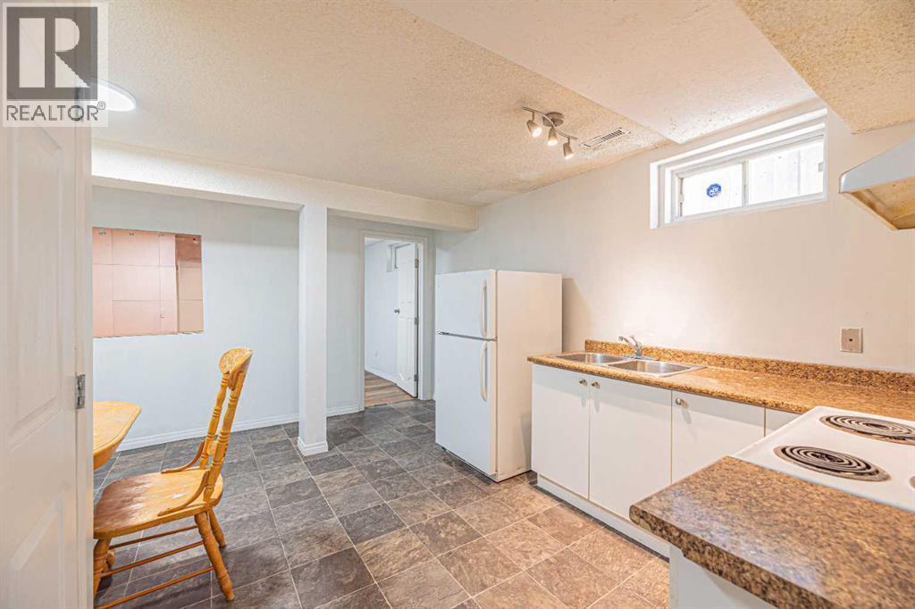 38 Martindale Drive Ne, Calgary, AB - Indoor Photo Showing Kitchen With Double Sink