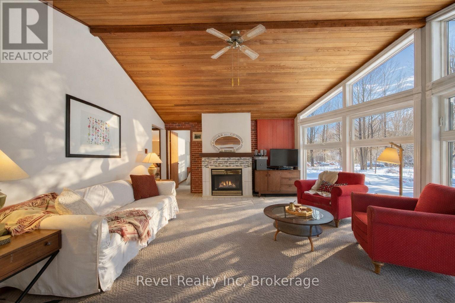 8 Manitou Crescent, Tiny, ON - Indoor Photo Showing Living Room With Fireplace