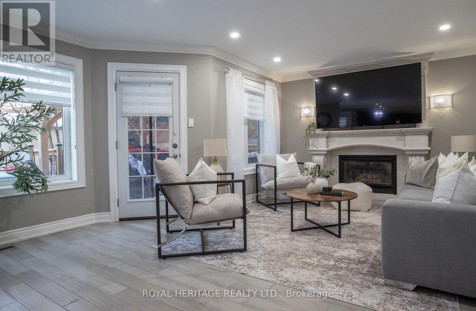 9 Sato Street, Whitby (Williamsburg), ON - Indoor Photo Showing Living Room With Fireplace