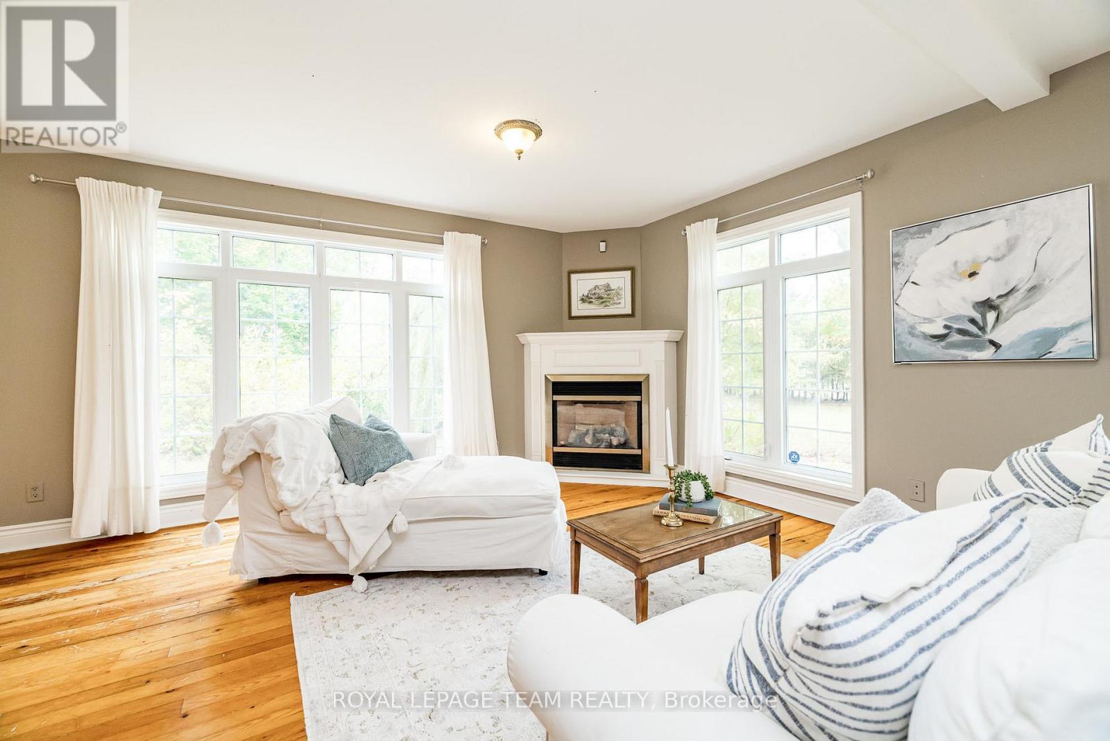 3651 Burritts Rapids Road, Ottawa, ON - Indoor Photo Showing Living Room With Fireplace