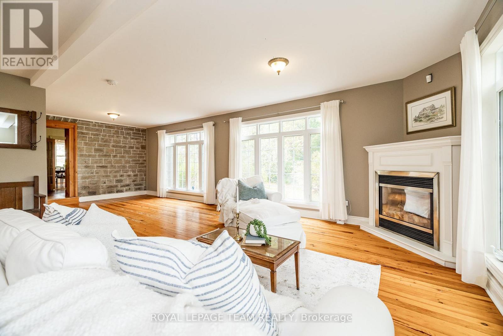 3651 Burritts Rapids Road, Ottawa, ON - Indoor Photo Showing Living Room With Fireplace