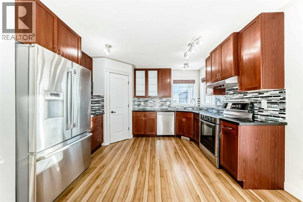 1156 Sherwood Boulevard Nw, Calgary, AB - Indoor Photo Showing Kitchen With Double Sink