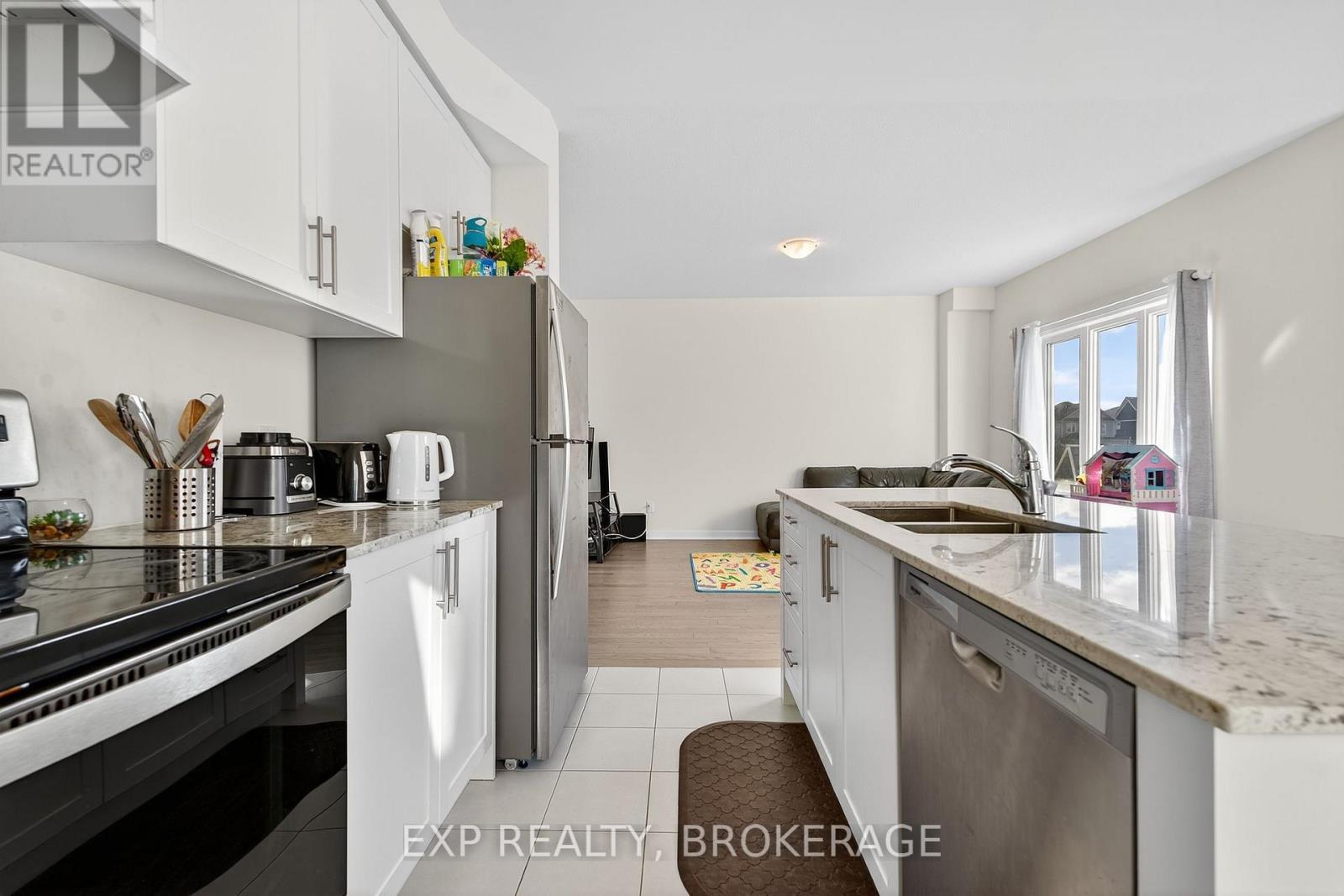 73 Oakmont Drive, Loyalist (Bath), ON - Indoor Photo Showing Kitchen With Double Sink