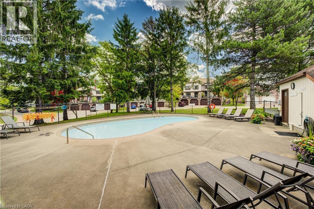 493 Beechwood Drive Unit# 4, Waterloo, ON - Outdoor With In Ground Pool