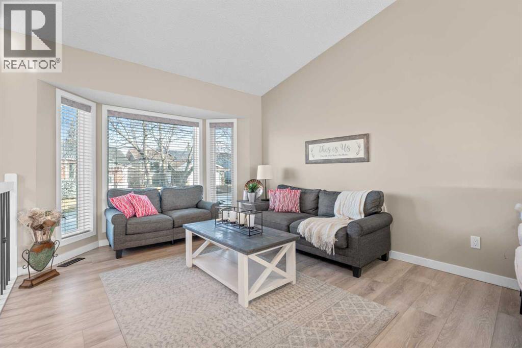 6 Easterbrook Place Se, Airdrie, AB - Indoor Photo Showing Living Room With Fireplace