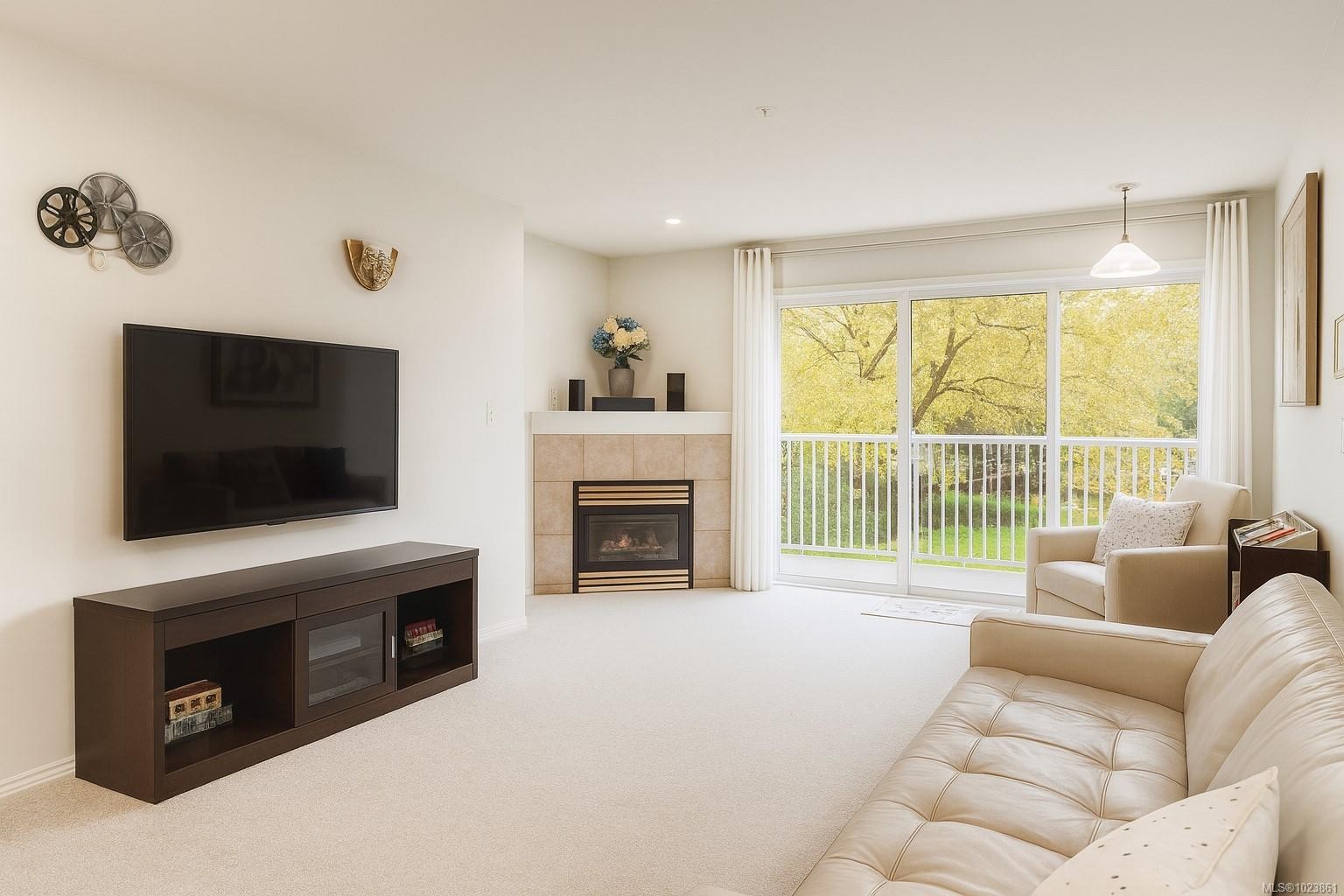 204-1240 Verdier Ave, Central Saanich, BC - Indoor Photo Showing Living Room With Fireplace