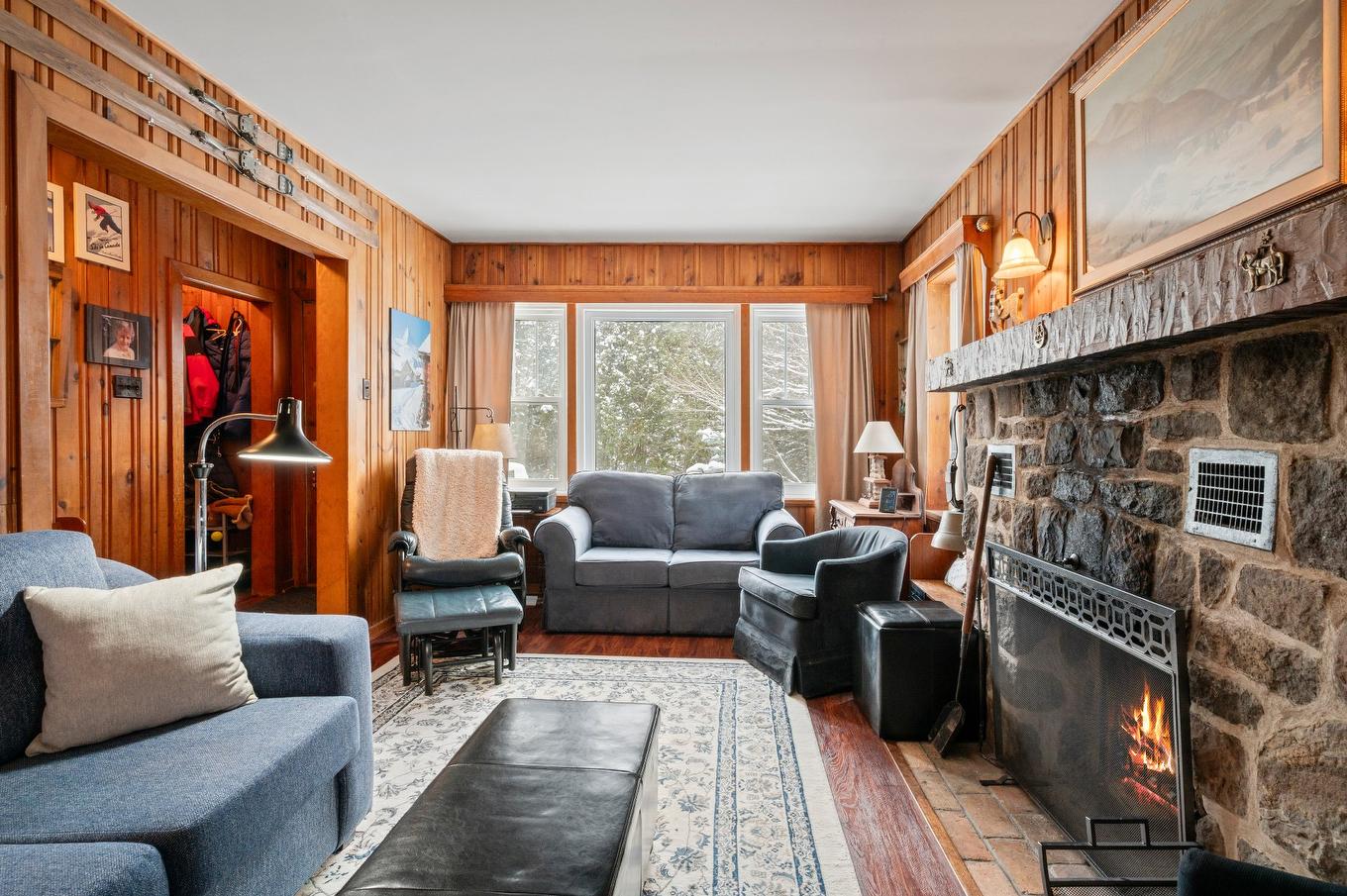 Living room - 233 Rue D'Aspen, Sainte-Adèle, QC - Indoor Photo Showing Living Room With Fireplace