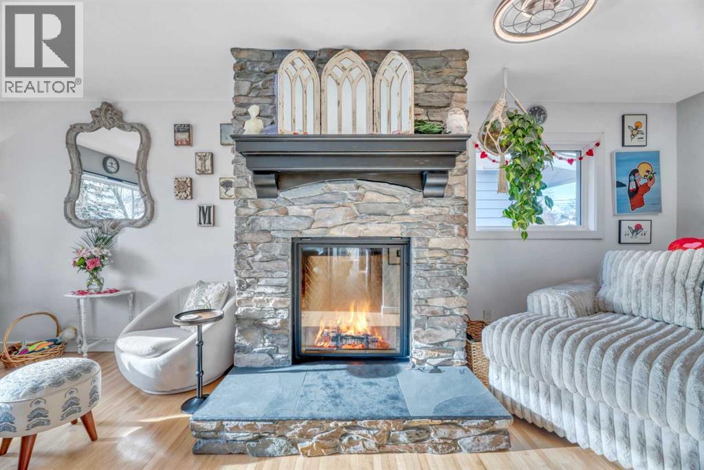 708 Allden Place Se, Calgary, AB - Indoor Photo Showing Living Room With Fireplace