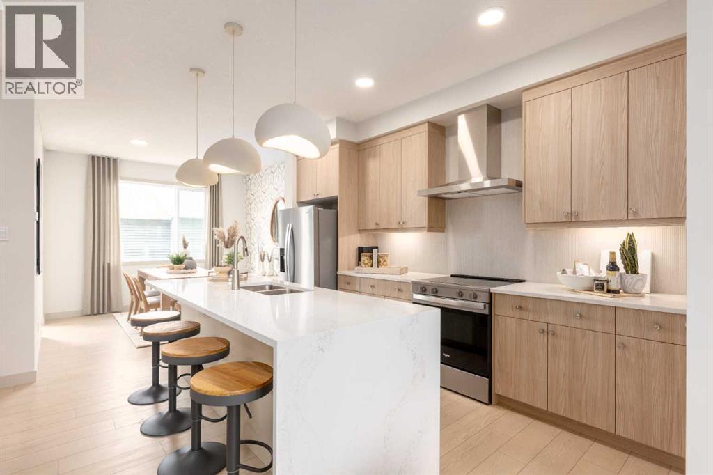 PLEASE NOTE: Photos are of a finished Showhome of the same model – fit and finish may differ on finished spec home. Interior selections and floorplans shown in photos - 129 Raven Link Se, Calgary, AB - Indoor Photo Showing Kitchen With Double Sink With Upgraded Kitchen