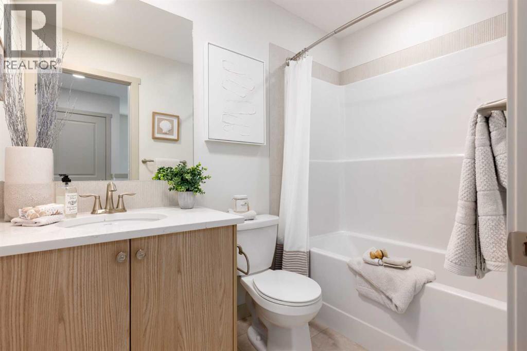 PLEASE NOTE: Photos are of a finished Showhome of the same model – fit and finish may differ on finished spec home. Interior selections and floorplans shown in photos - 129 Raven Link Se, Calgary, AB - Indoor Photo Showing Bathroom