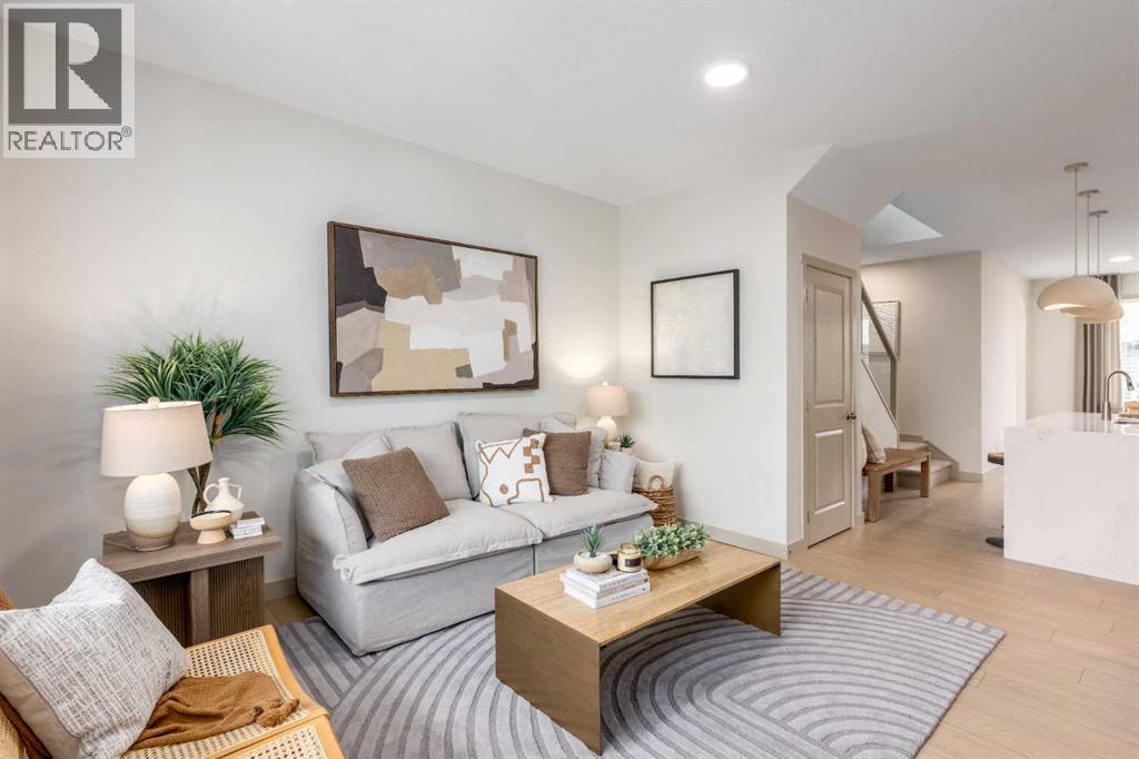 PLEASE NOTE: Photos are of a finished Showhome of the same model – fit and finish may differ on finished spec home. Interior selections and floorplans shown in photos - 129 Raven Link Se, Calgary, AB - Indoor Photo Showing Living Room