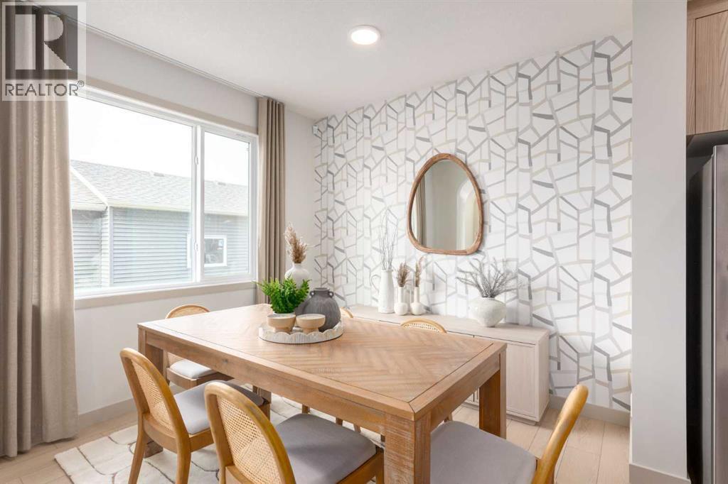 PLEASE NOTE: Photos are of a finished Showhome of the same model – fit and finish may differ on finished spec home. Interior selections and floorplans shown in photos - 129 Raven Link Se, Calgary, AB - Indoor Photo Showing Dining Room