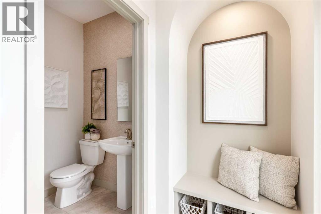 PLEASE NOTE: Photos are of a finished Showhome of the same model – fit and finish may differ on finished spec home. Interior selections and floorplans shown in photos - 129 Raven Link Se, Calgary, AB - Indoor Photo Showing Bathroom