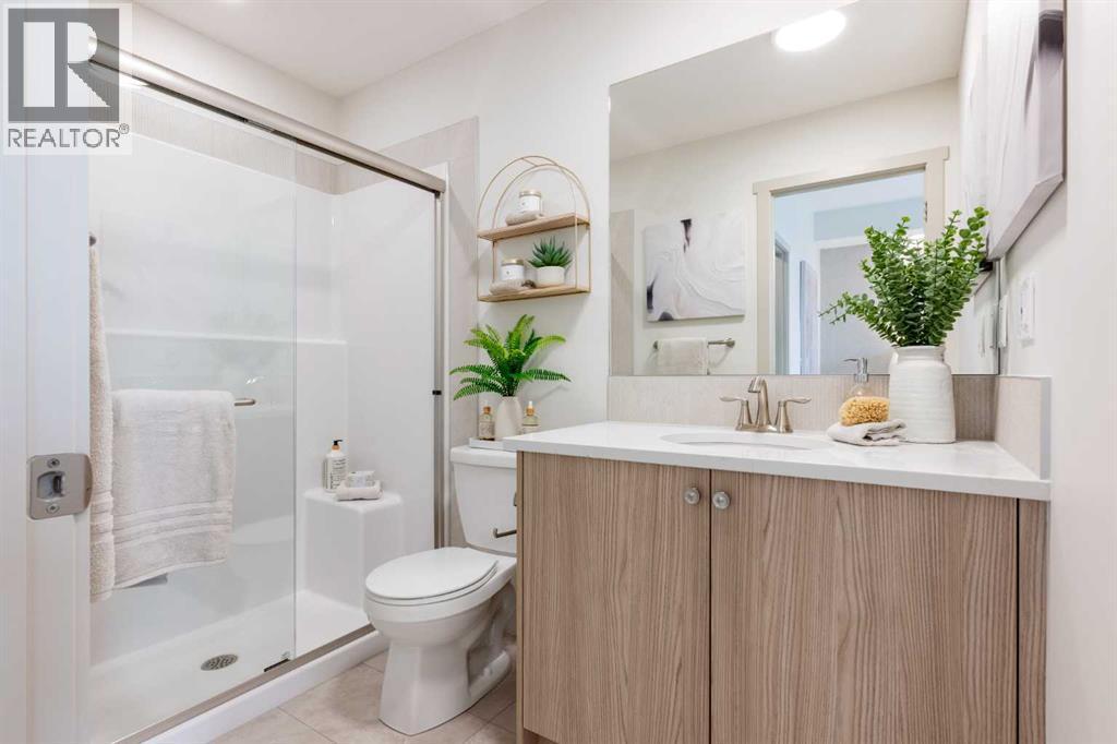 PLEASE NOTE: Photos are of a finished Showhome of the same model – fit and finish may differ on finished spec home. Interior selections and floorplans shown in photos - 129 Raven Link Se, Calgary, AB - Indoor Photo Showing Bathroom