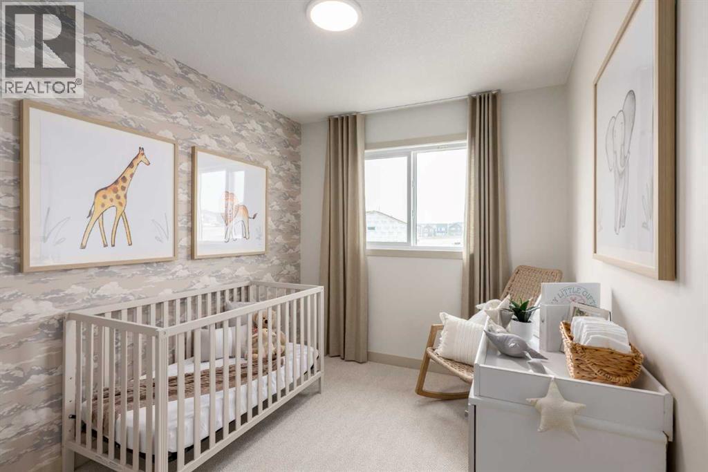 PLEASE NOTE: Photos are of a finished Showhome of the same model – fit and finish may differ on finished spec home. Interior selections and floorplans shown in photos - 129 Raven Link Se, Calgary, AB - Indoor Photo Showing Bedroom