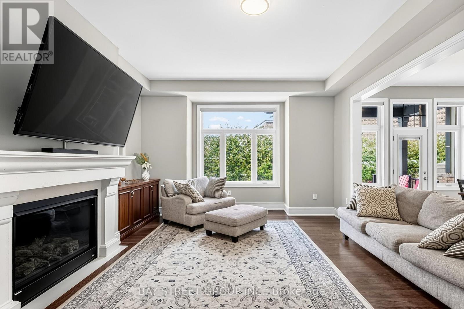 Second Stone Mantle Gas Fireplace for Cozy Winters - 39 Cairns Gate, King, ON - Indoor Photo Showing Living Room With Fireplace