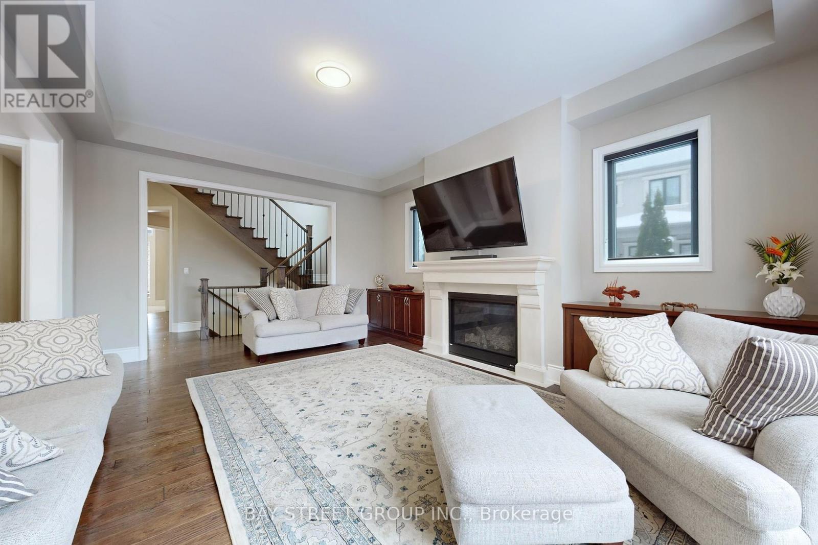 Large Oversized Windows Offer Tons of Natur. Light - 39 Cairns Gate, King, ON - Indoor Photo Showing Living Room With Fireplace