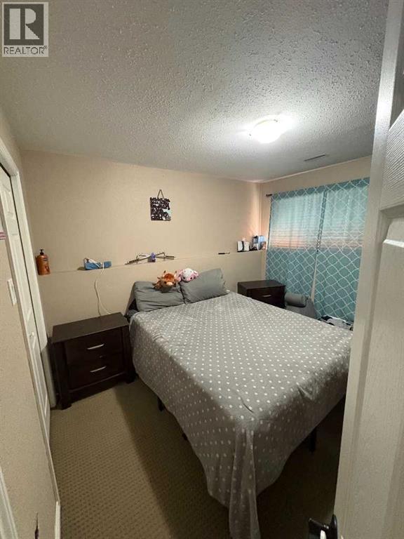 2, 1701 St Edward Boulevard N, Lethbridge, AB - Indoor Photo Showing Bedroom