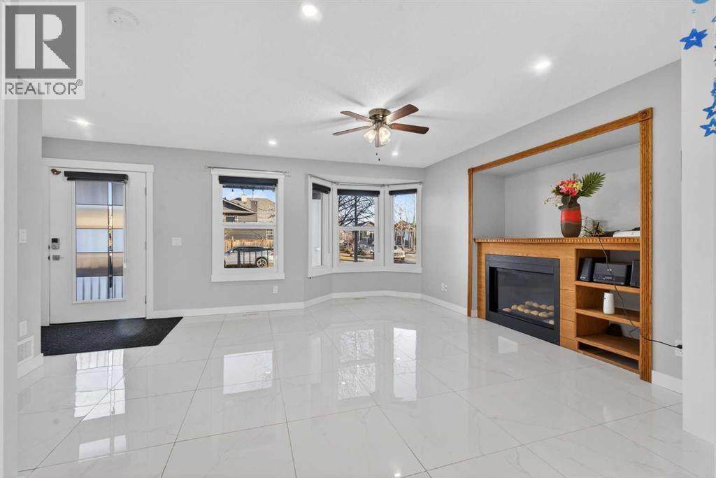 49 Taravista Way Ne, Calgary, AB - Indoor Photo Showing Other Room With Fireplace