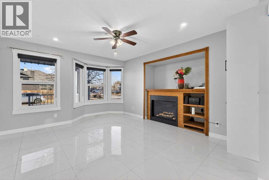 49 Taravista Way Ne, Calgary, AB - Indoor With Fireplace