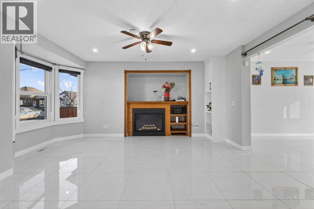49 Taravista Way Ne, Calgary, AB - Indoor With Fireplace