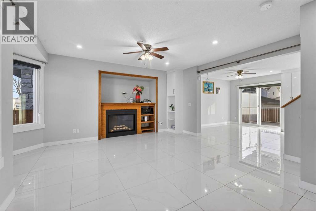49 Taravista Way Ne, Calgary, AB - Indoor With Fireplace