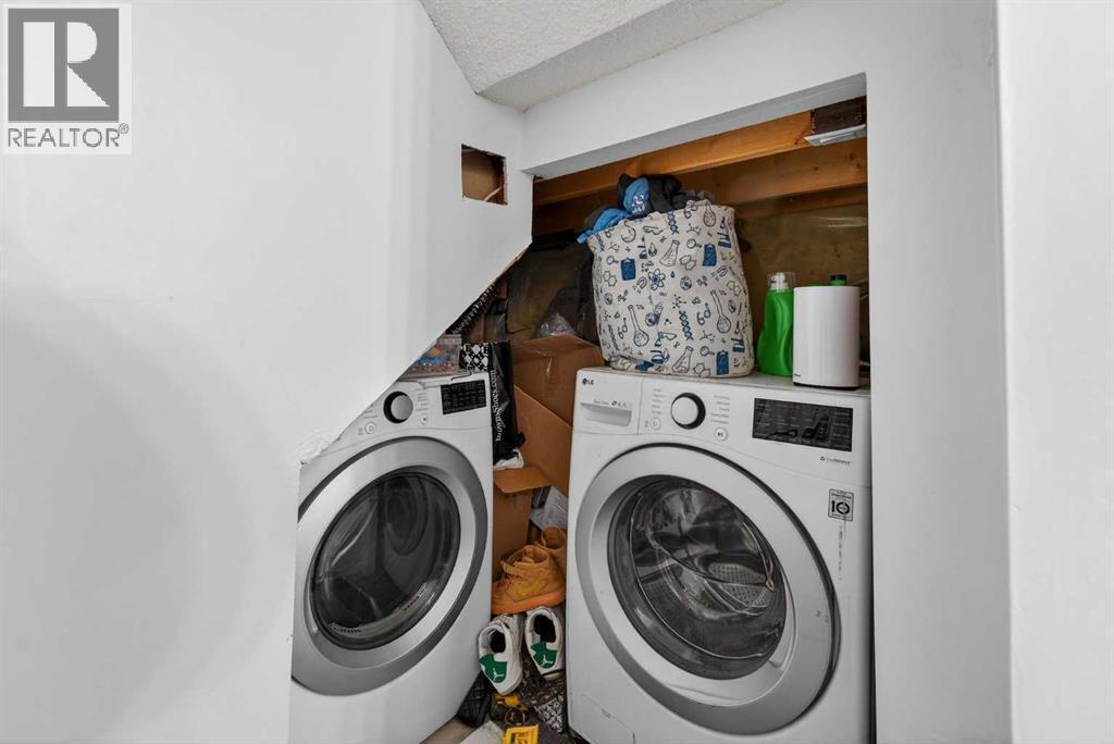 49 Taravista Way Ne, Calgary, AB - Indoor Photo Showing Laundry Room