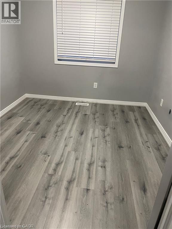 Empty room featuring wood finished floors and baseboards - 198 Maitland Street, Kitchener, ON - Indoor Photo Showing Other Room