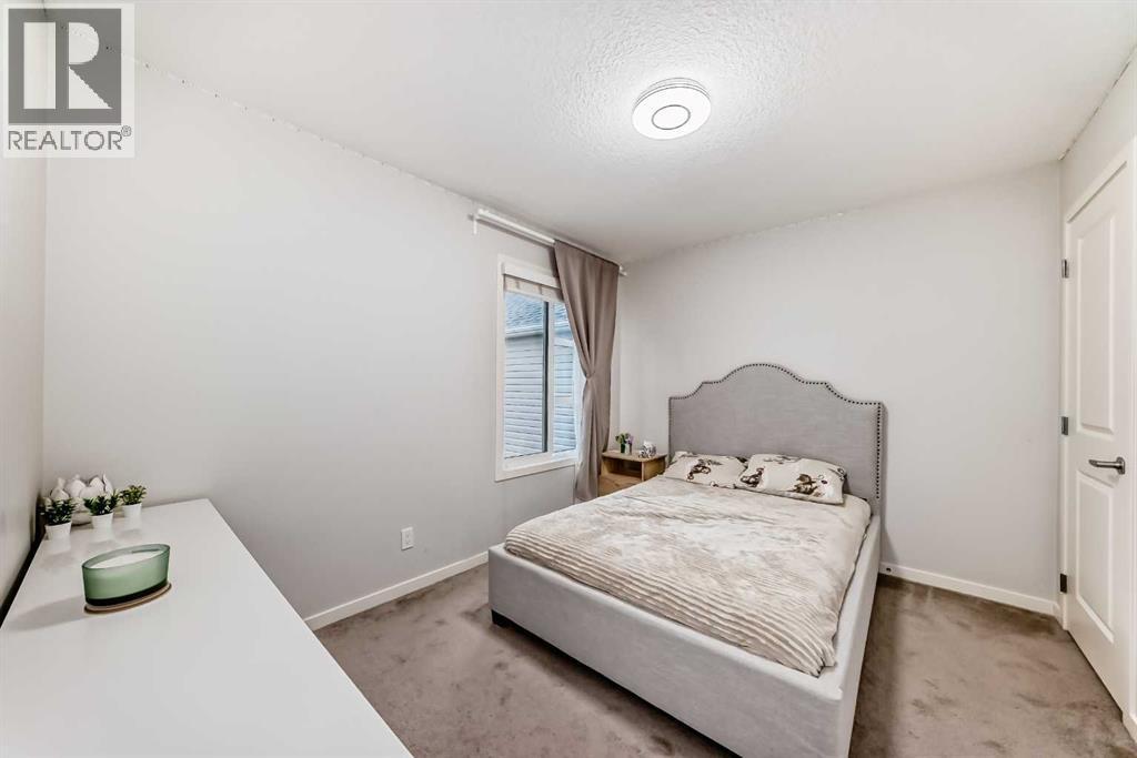 54 Seton Manor Se, Calgary, AB - Indoor Photo Showing Bedroom