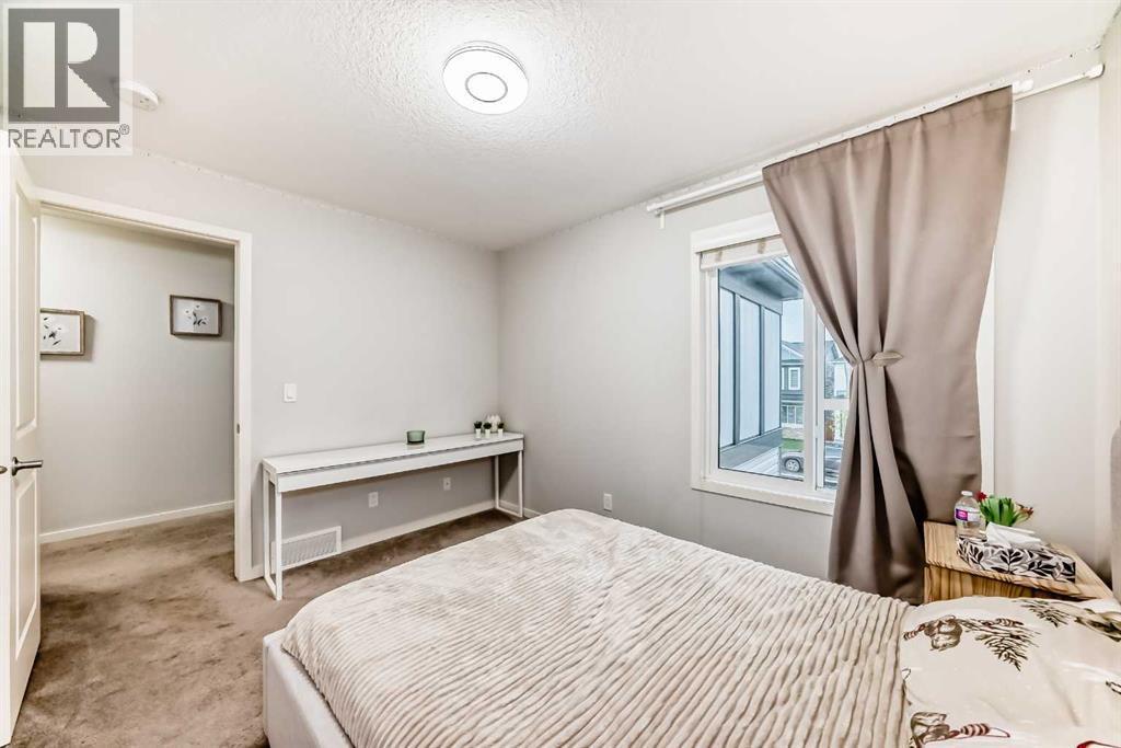 54 Seton Manor Se, Calgary, AB - Indoor Photo Showing Bedroom