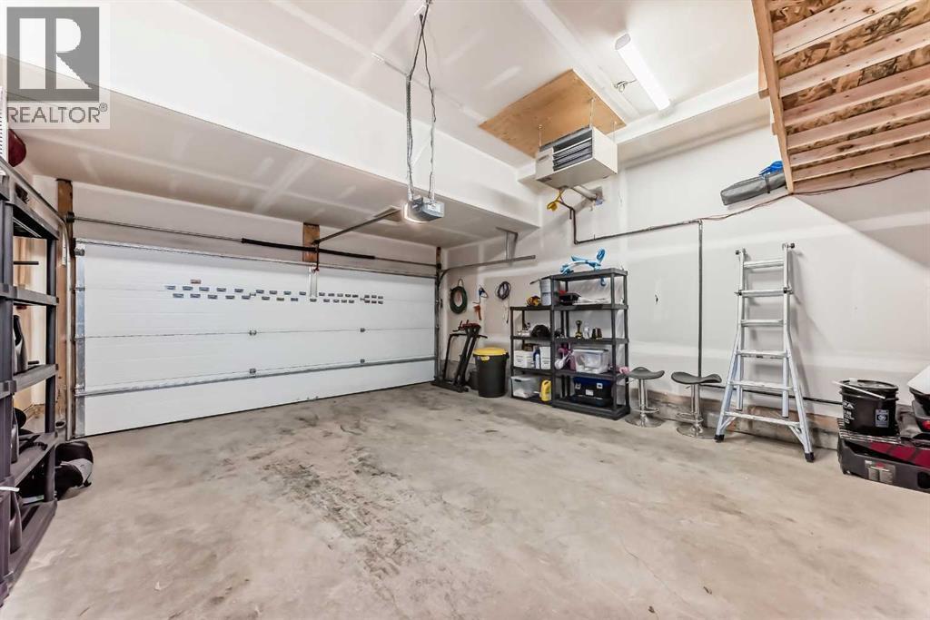 54 Seton Manor Se, Calgary, AB - Indoor Photo Showing Garage
