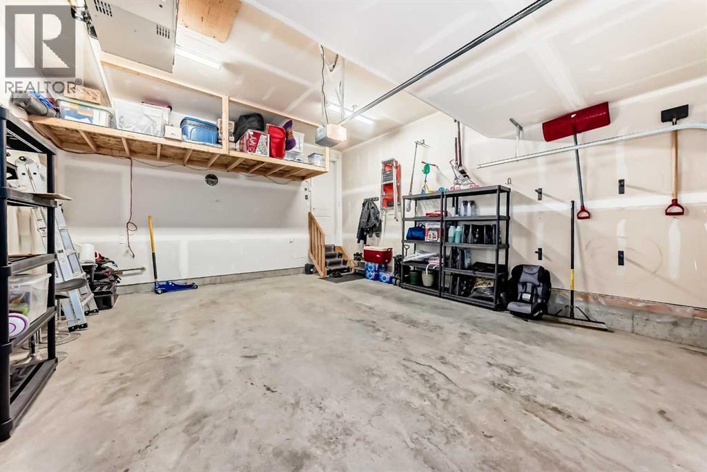 54 Seton Manor Se, Calgary, AB - Indoor Photo Showing Garage