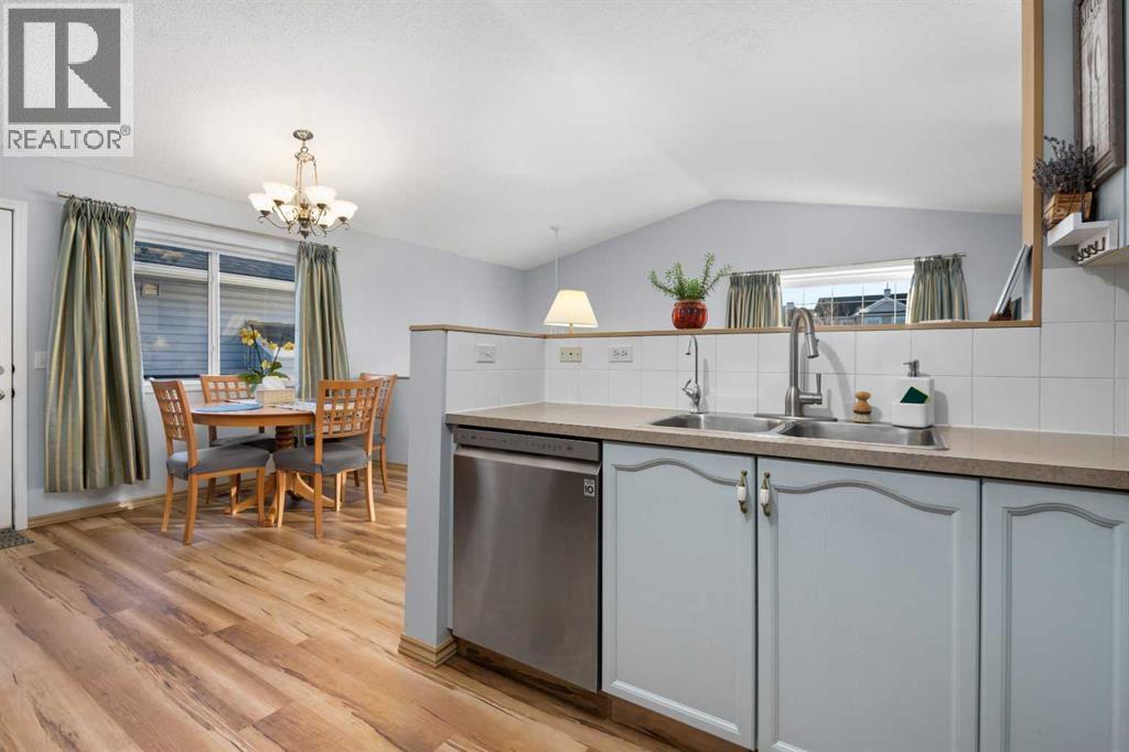 118 Bridleridge Way Sw, Calgary, AB - Indoor Photo Showing Kitchen With Double Sink