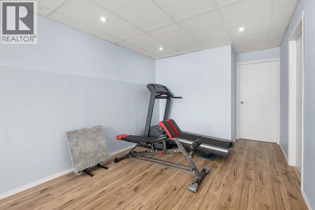 118 Bridleridge Way Sw, Calgary, AB - Indoor Photo Showing Gym Room