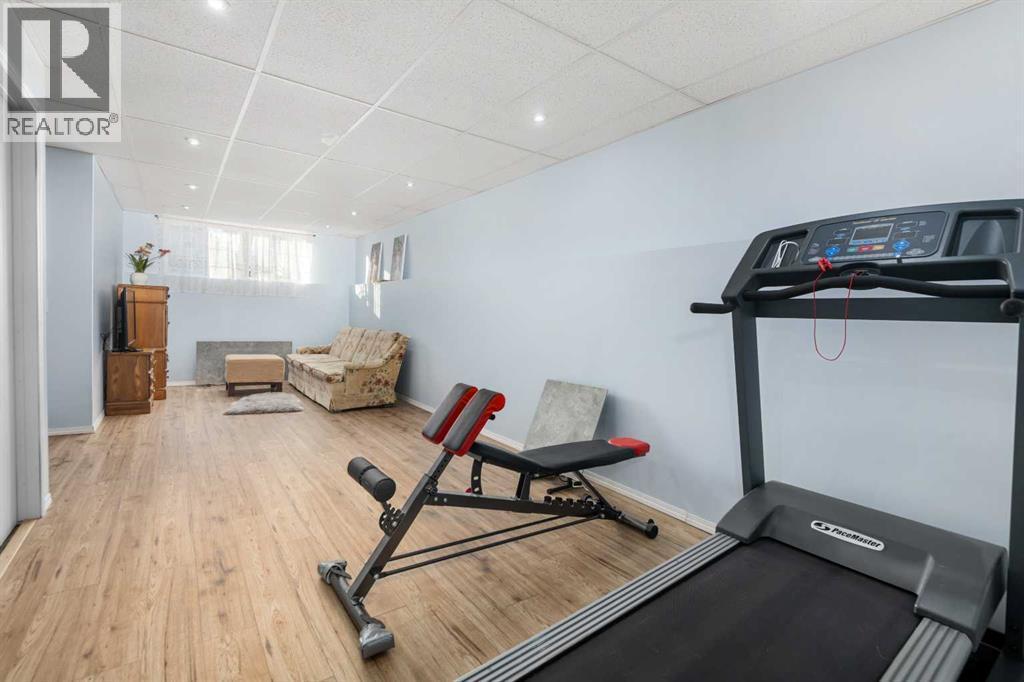 118 Bridleridge Way Sw, Calgary, AB - Indoor Photo Showing Gym Room