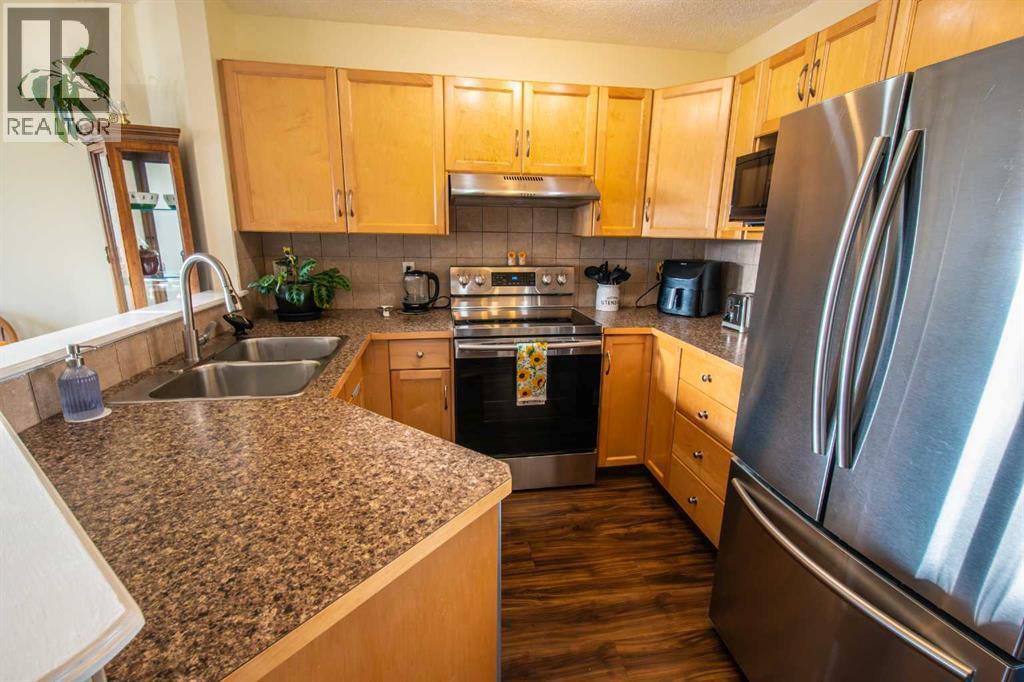 11 Saddlebrook Mews Ne, Calgary, AB - Indoor Photo Showing Kitchen With Stainless Steel Kitchen With Double Sink