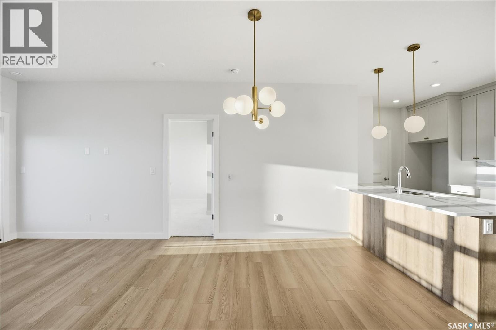 1303 101 Secord Way, Saskatoon, SK - Indoor Photo Showing Kitchen With Double Sink